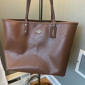 Used- Reversible Coach Brown Leather Tote Bag- monogram design inside.